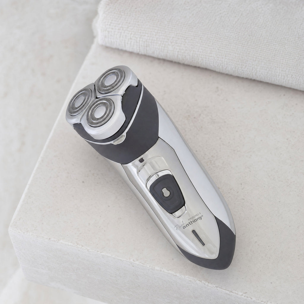 Mens Rotary Shaver Cordless Rechargeable Silver 3 Titanium Heads Trimmer New — cordless, at rest on a bathroom shelf