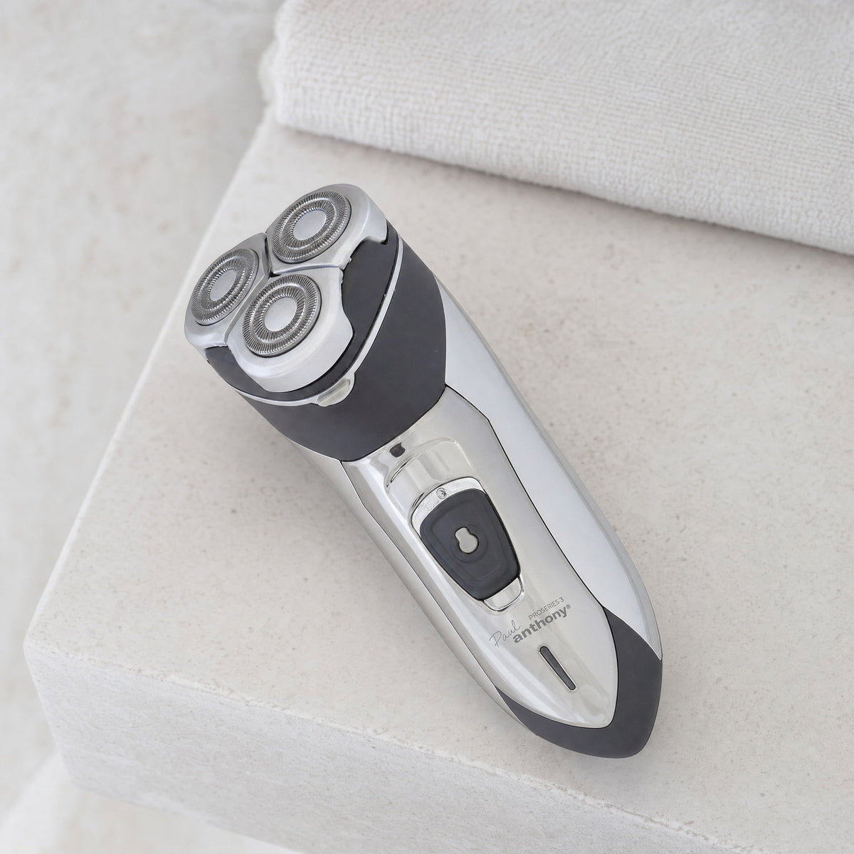 Mens Rotary Shaver Cordless Rechargeable Silver 3 Titanium Heads Trimmer New — cordless, at rest on a bathroom shelf