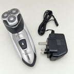 Mens Rotary Shaver Cordless Rechargeable Silver 3 Titanium Heads Trimmer New — shown with its UK 3-pin mains adaptor
