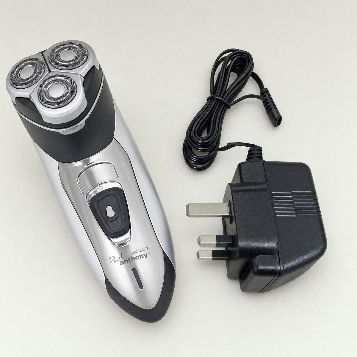 Mens Rotary Shaver Cordless Rechargeable Silver 3 Titanium Heads Trimmer New — shown with its UK 3-pin mains adaptor
