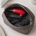 Travel Hair Dryer 1200W Compact Folding Handle Dual Voltage 2 Heat Settings New — folded and packed inside an open wash bag