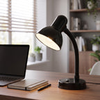 Lloytron 35W Classic Flexi desk lamp, black, lit on a home office desk beside a laptop