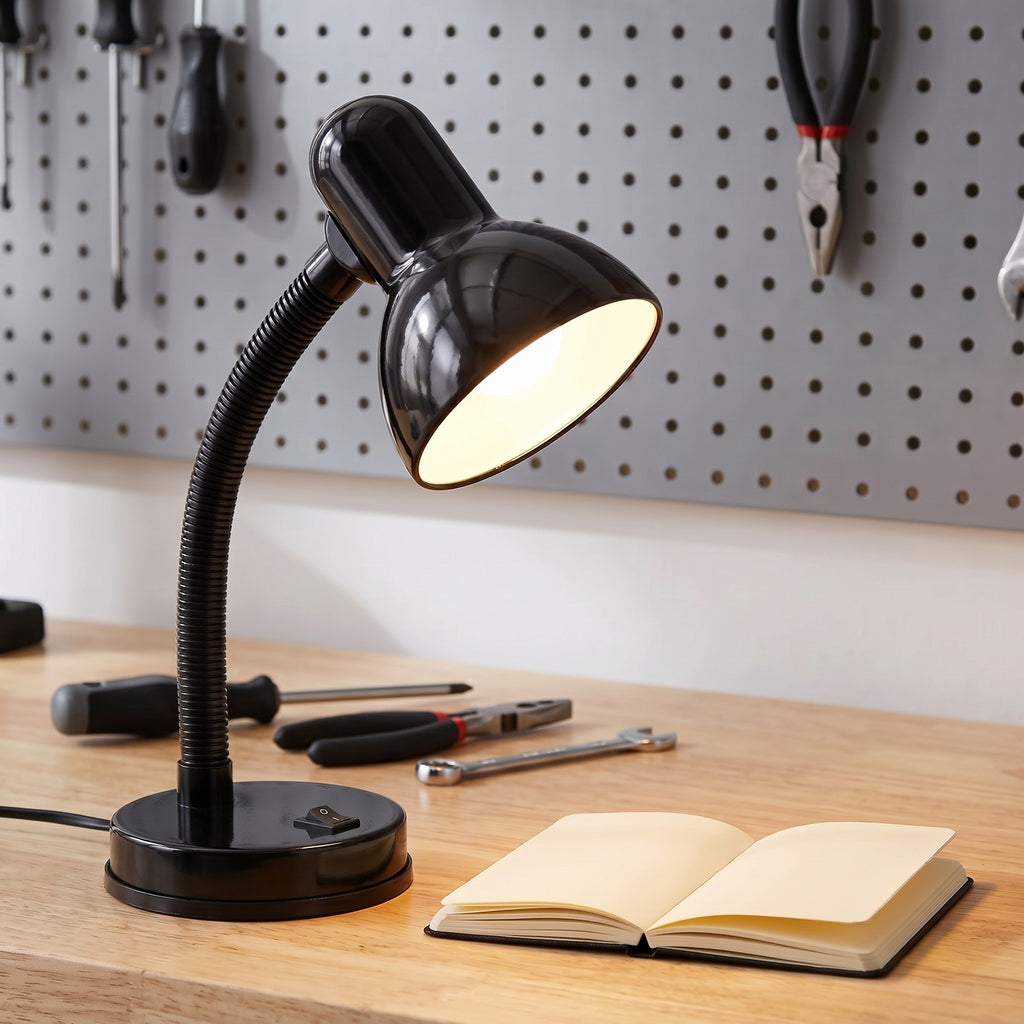 Lloytron 35W Classic Flexi desk lamp, black, lit over a workbench