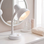 Lloytron 35W Classic Flexi desk lamp, white, lit at a dressing table mirror