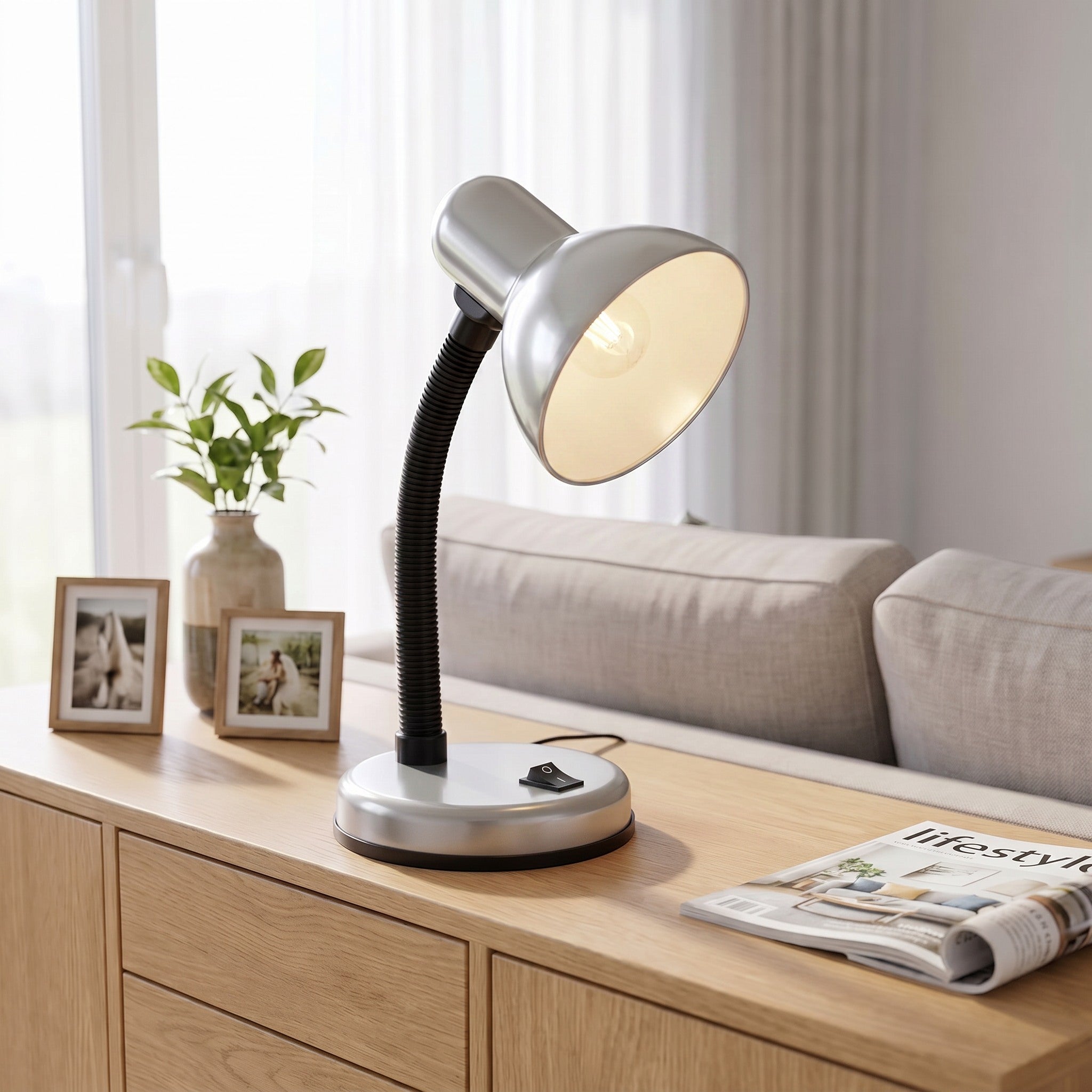 Lloytron 35W Classic Flexi desk lamp, silver, lit on a living room sideboard