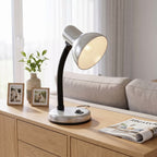 Lloytron 35W Classic Flexi desk lamp, silver, lit on a living room sideboard
